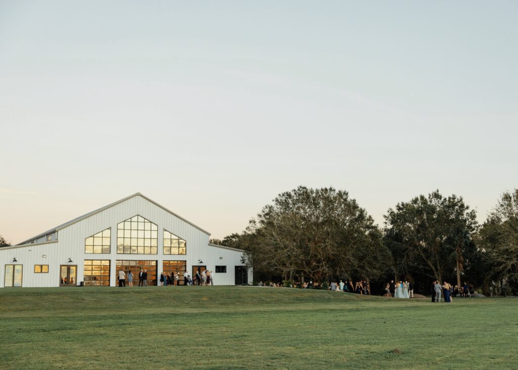 outdoor cocktail space for wedding, luxury barn wedding venue during cocktail hour, barn venue in central florida