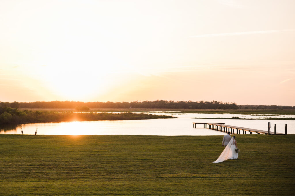 bride and groom at sunset, luxury barn wedding venue on Lake Tohopekaliga in Saint Cloud, Florida