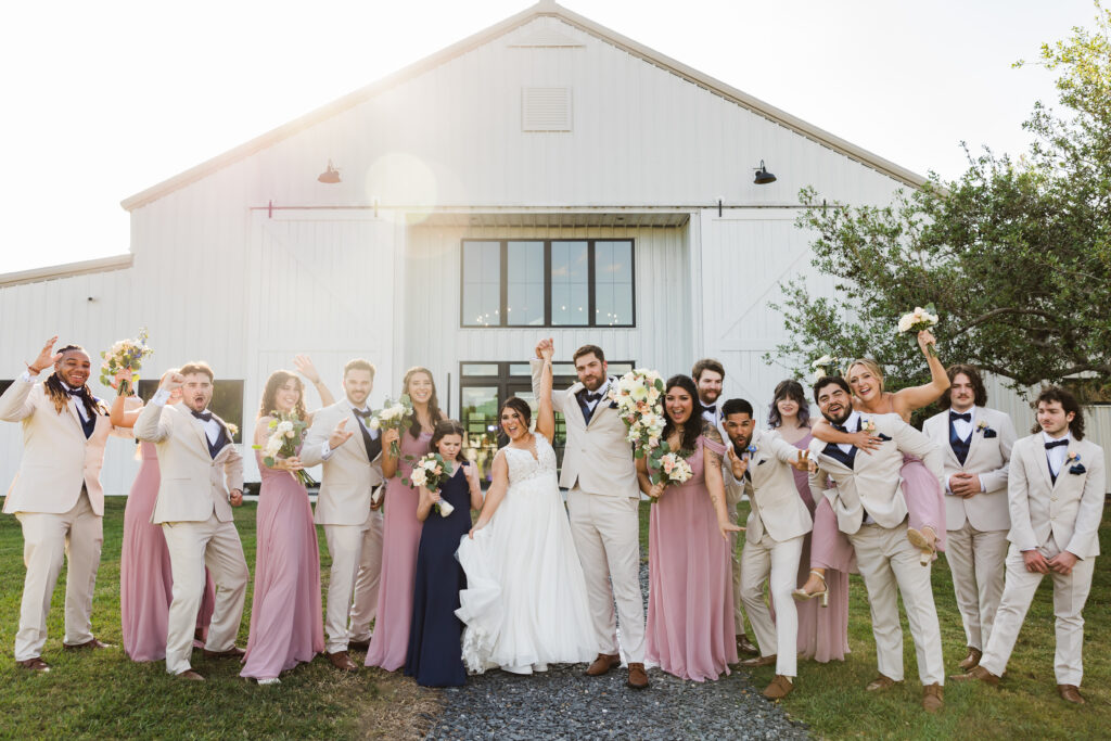 Bridal party celebrating at luxury barn wedding venue in Saint Cloud, Florida