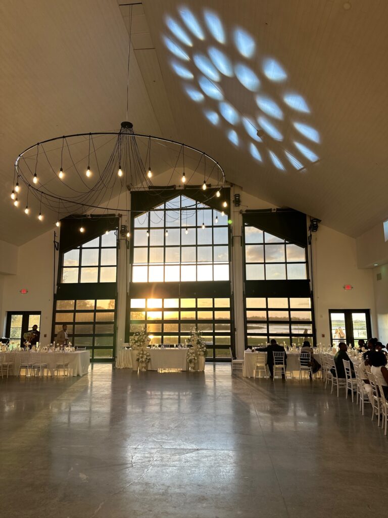 lakeside luxury barn wedding venue in Saint Cloud, Florida with DJ lighting