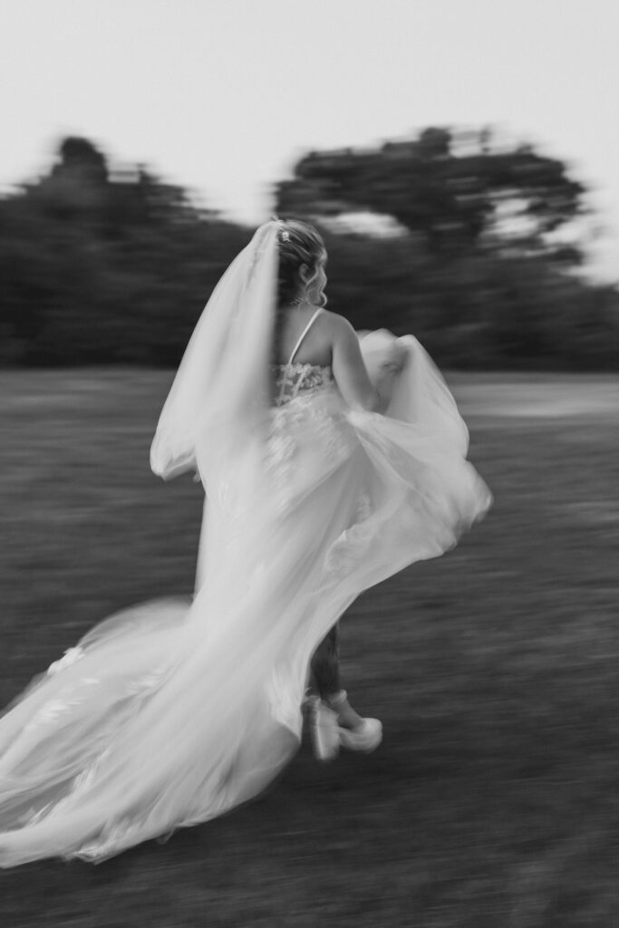 Bridal moments captured with bride running through the Florida farm
