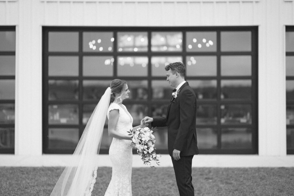 bride and groom doing a first look for their Florida barn wedding
