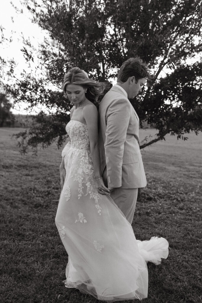 bride and groom holding hands for a first touch at Central Florida wedding venue