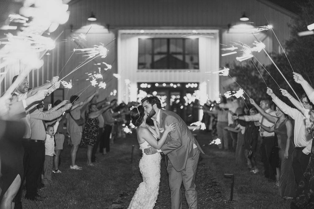 bride and groom during outdoor grand exit with sparklers at Central Florida wedding venue