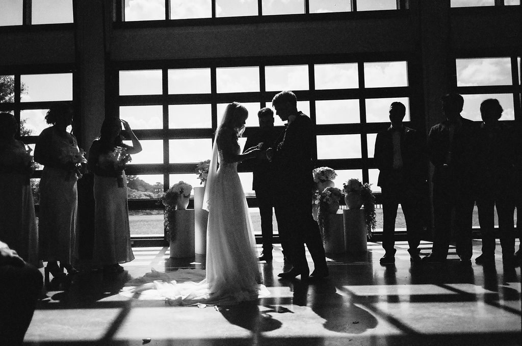 bride and groom standing in prayer at Orlando wedding venue