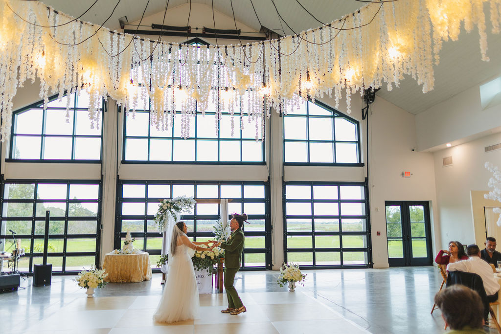 bride and groom first dance at luxury barn wedding venue in Saint Cloud, Florida