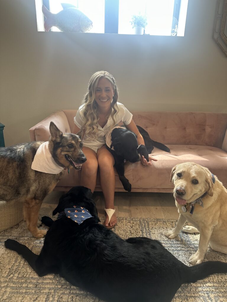 Bride in bridal suite in venue near Kissimmee, Florida with her four dogs
