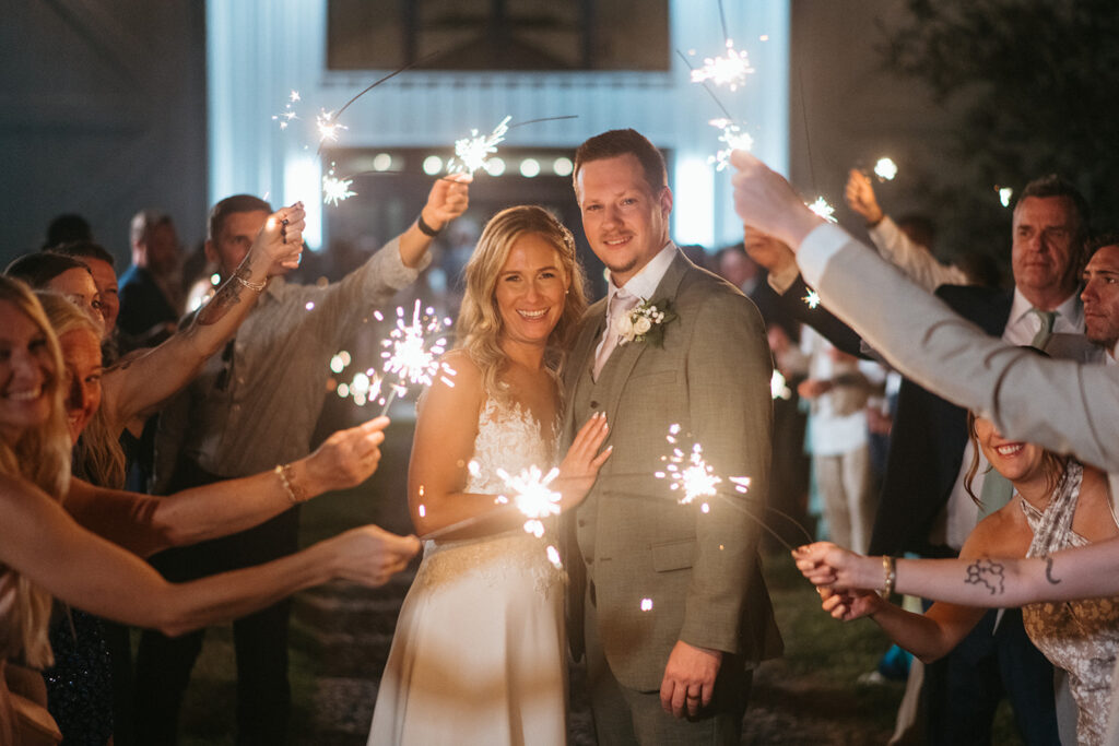 bride and groom during grand exit after wedding reception at lakeside, Florida wedding venue
