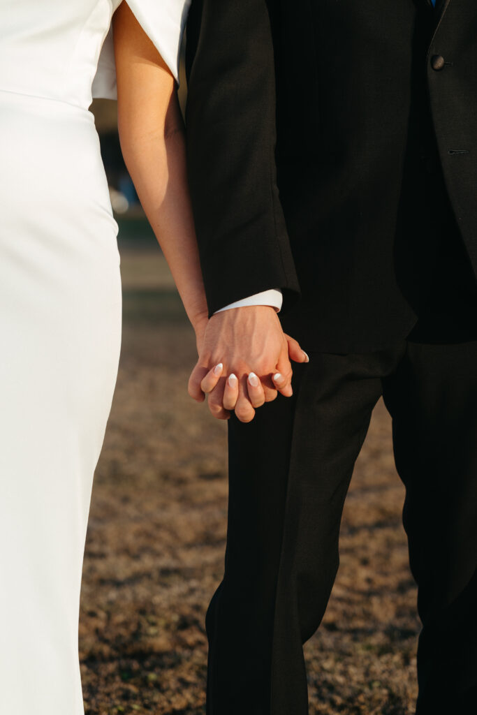 husband and wife holding hands after wedding ceremony at Central Florida wedding venue