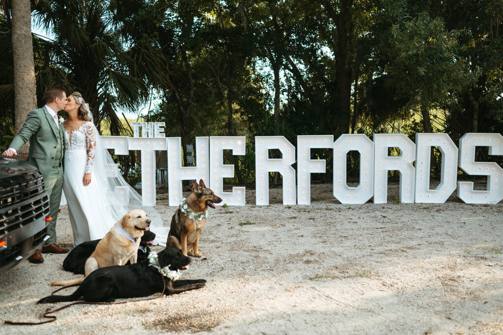 bride and groom kissing in cocktail space after ceremony at wedding venue in Orlando