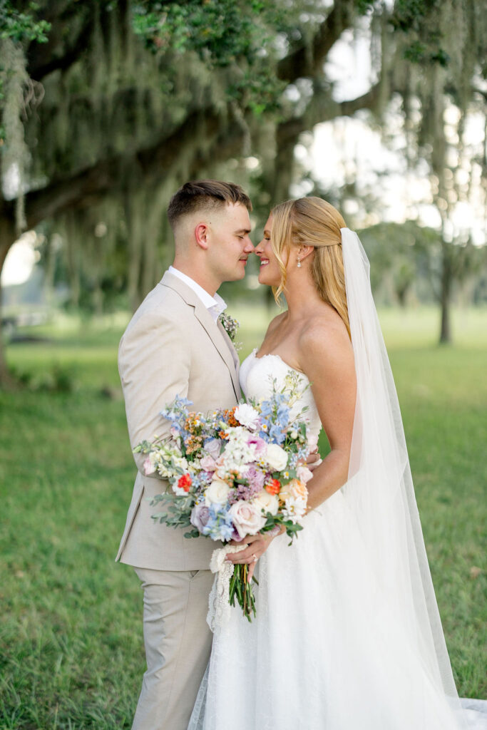 bride and groom at Lavender on the Lake, a wedding venue in Saint Cloud Florida about to kiss as husband and wife