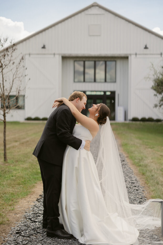 bride and groom outside of the luxury barn wedding venue in Orlando, Florida