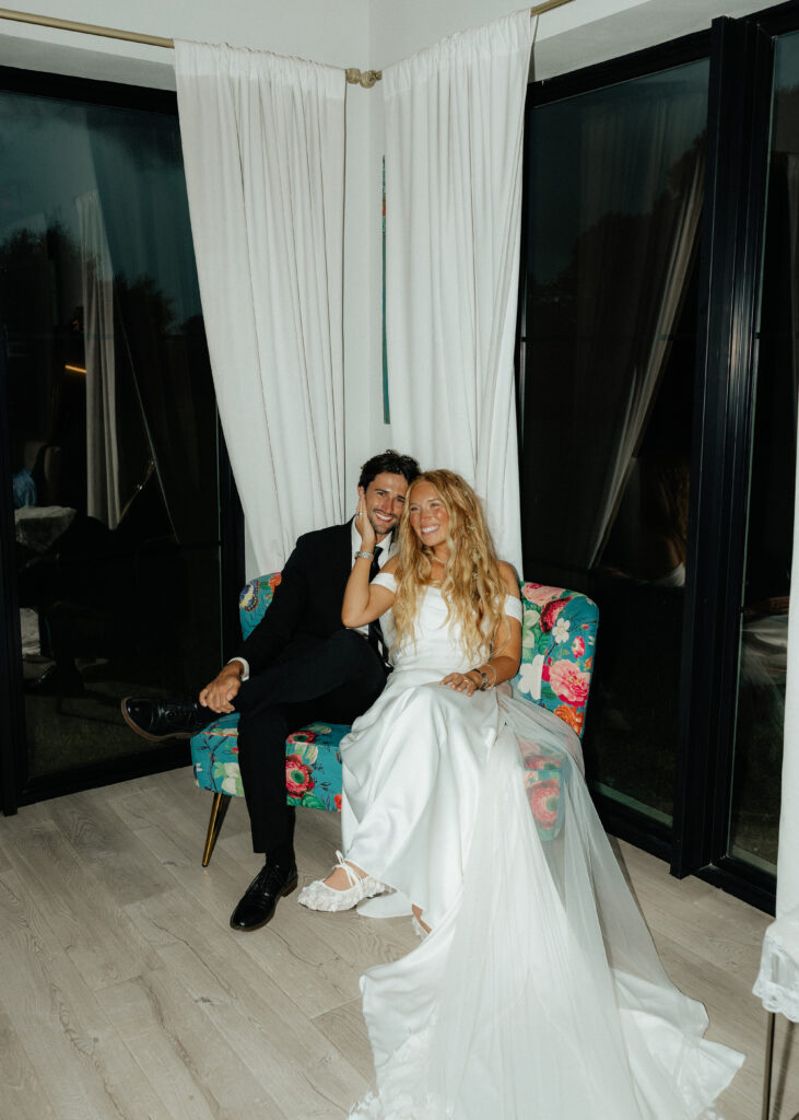 Bride and groom sharing a moment in the bridal suite during their wedding reception