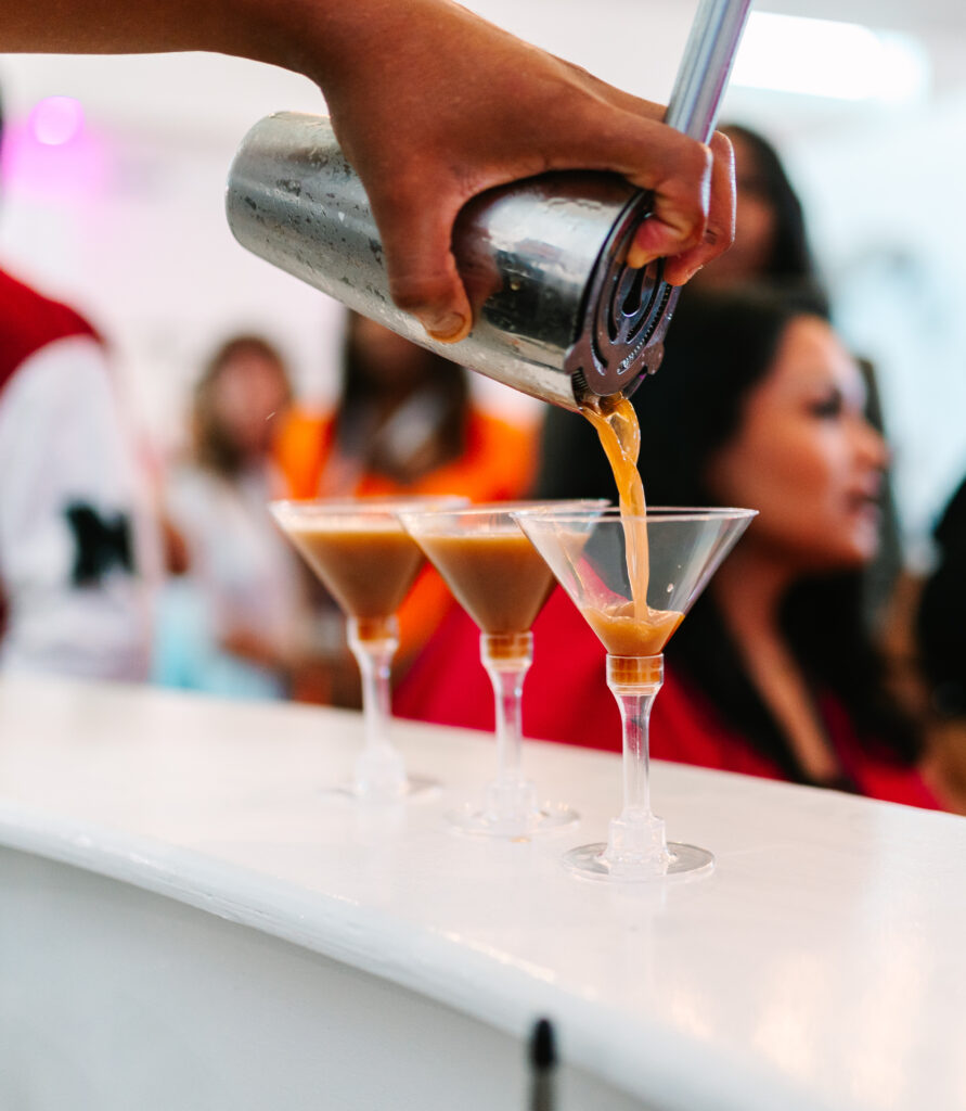 bartender pouring cocktails at reception