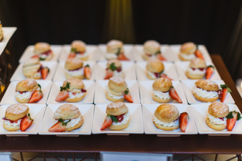 mini strawberry shortcake dessert table at wedding in central florida luxury barn wedding venue