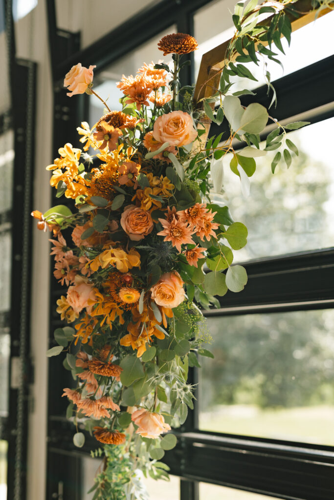 beautiful floral bouquet from Florida florist decorating the ceremonial arch, Saint Cloud wedding venue
