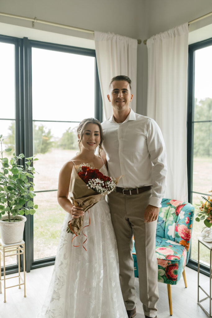 bride and brother with bridal bouquet in the bridal suite before the wedding
